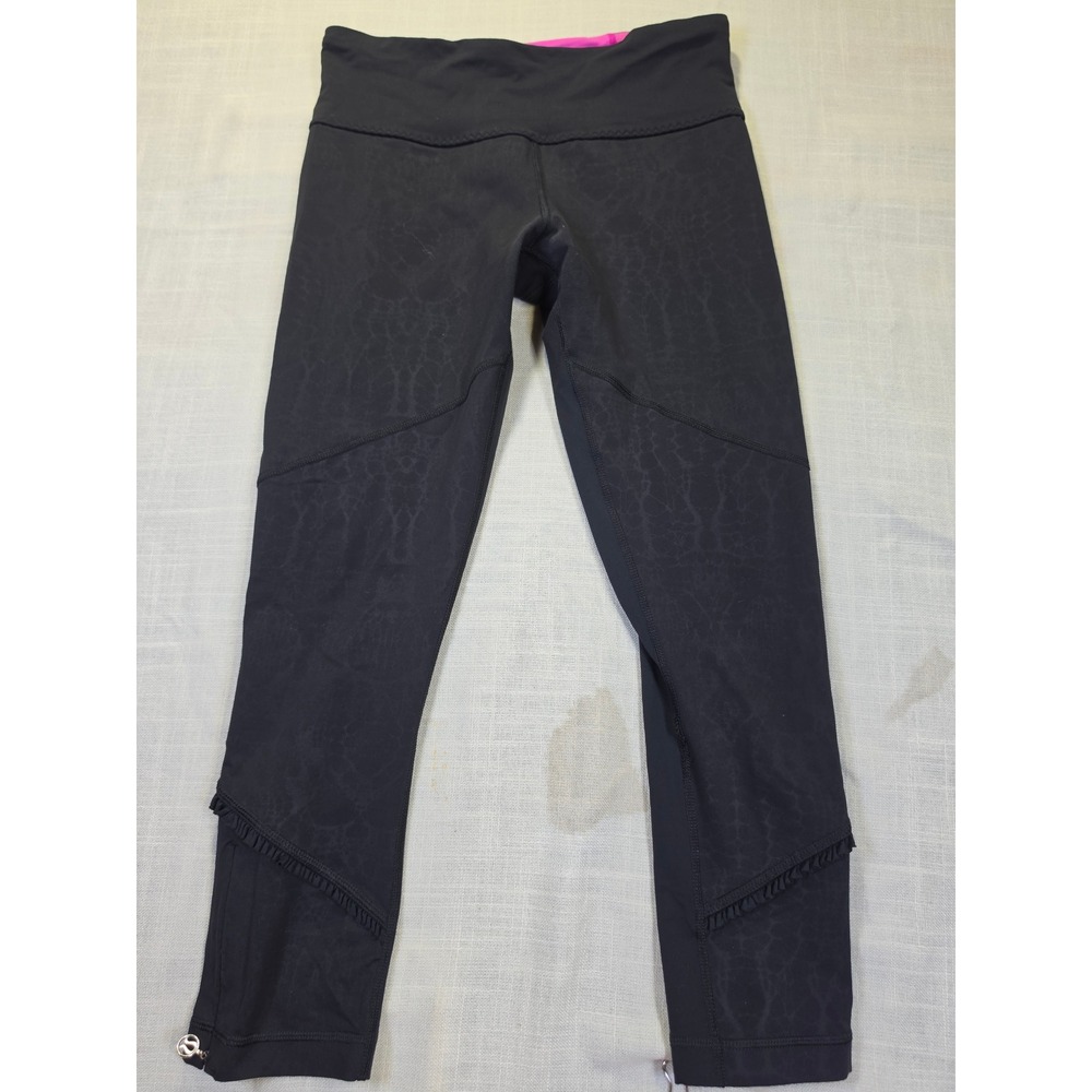 Lululemon Black Snakeskin Print Crop Leggings Ruffle Trim Reflective Pink Waist